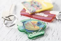 přívěšek na klíče průhledná zelená s potiskem loga - foto 6