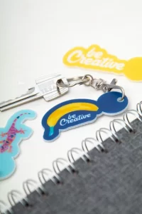 přívěšek na klíče se žetonem do vozíku bílá s potiskem loga - foto 6